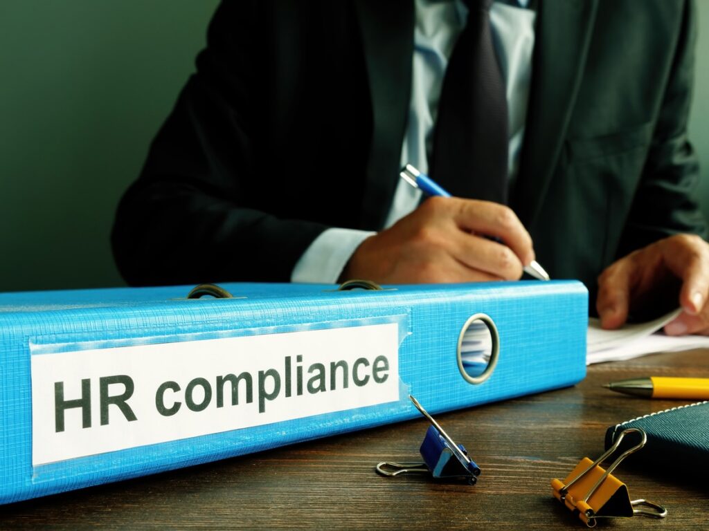 folder with hr compliance reports and manager.