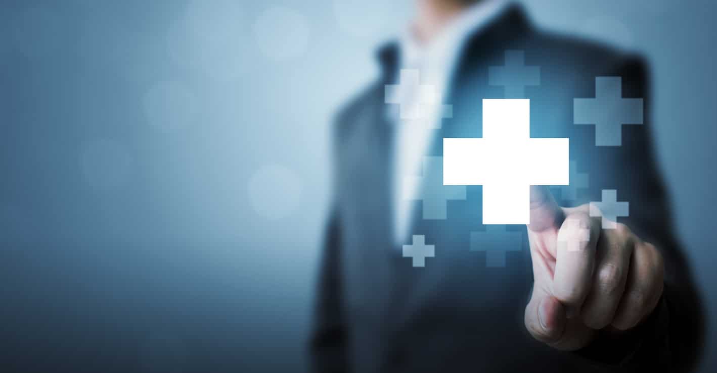 businessman hand touching plus sign icon means to offer positive thing (like benefits, personal development, social network)
