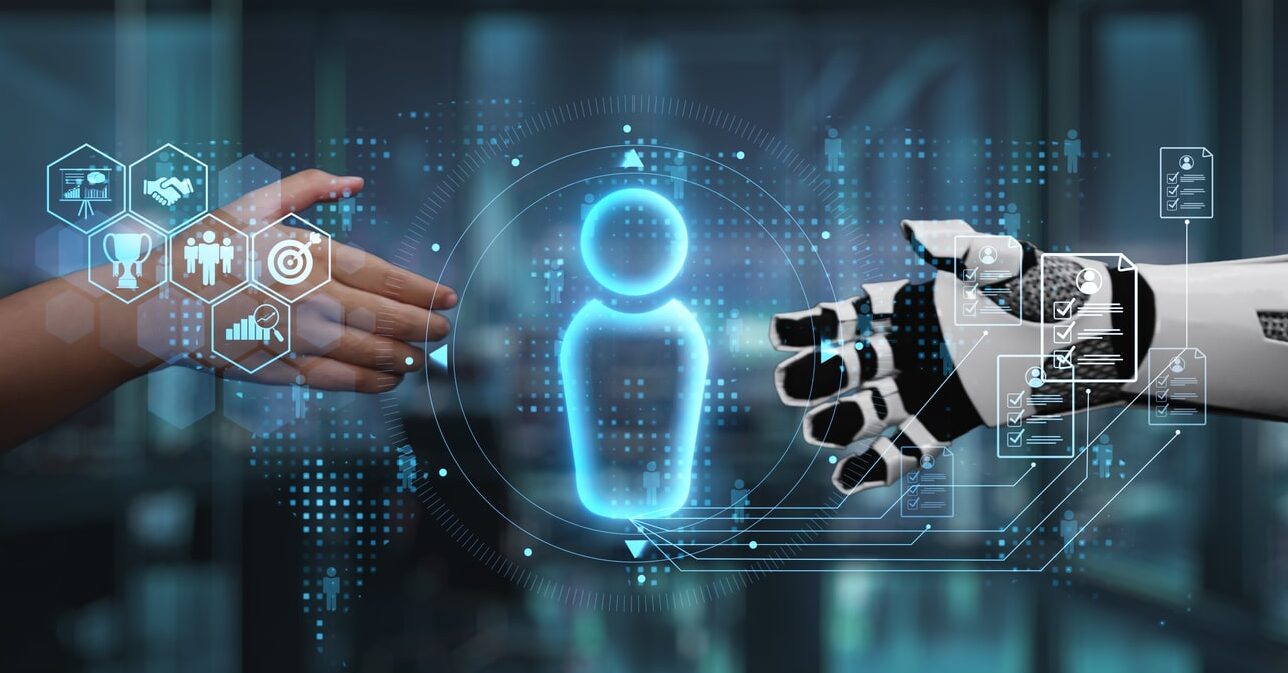 human and robot hand interaction symbolizing future collaboration and technological advancement in innovative business environment. auvana