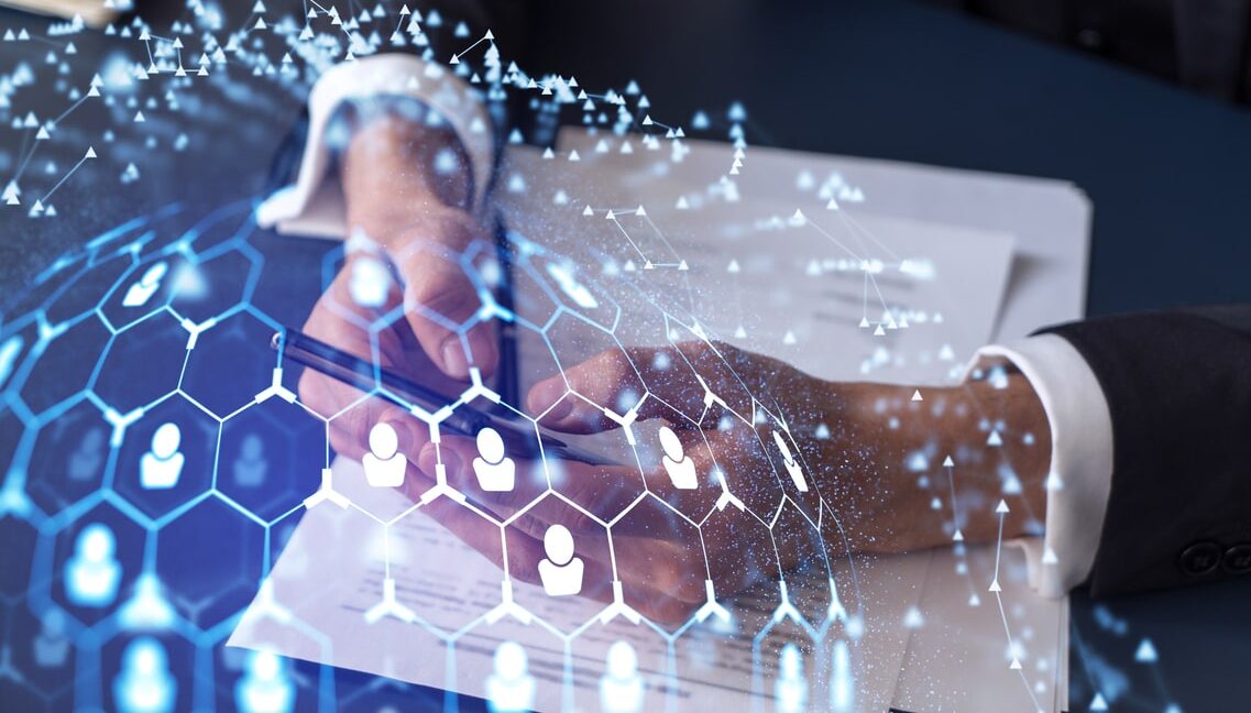 a potential employee in formal wear reading the contract to boost his career and gain new opportunities in personal growth. checking the details of the deal at smartphone. social media hologram icons