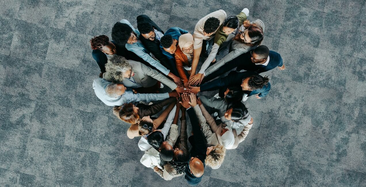 top view of a a heart shape of people, showing unity and teamwork