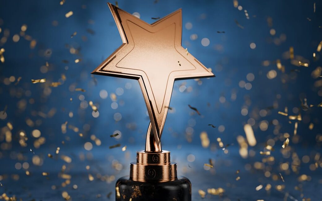 gold star on a blue background as a reward. top performance award. winners cup. achievements. victory. goal achievement concept. winner certificate. first place in a computer game. 3d rendering.