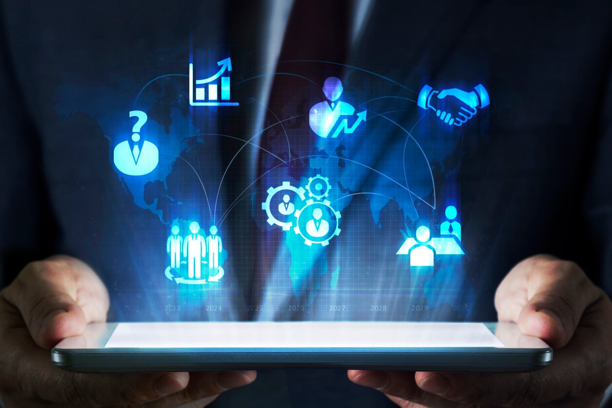 tablet computer showing icons to do with HR and business practice